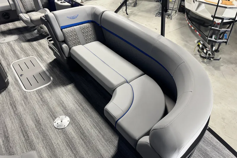 Slide: The Image of 2026 Bennington 24 MSB boat interior with luxurious gray seating and modern design. - 6