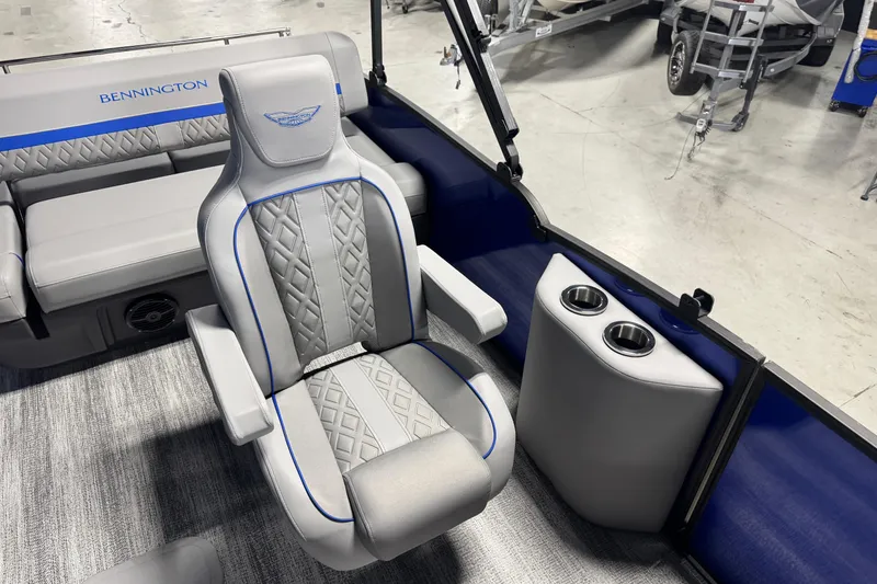 Slide: The Image of 2026 Bennington 24 MSB boat interior with luxurious seating and cup holders. - 8