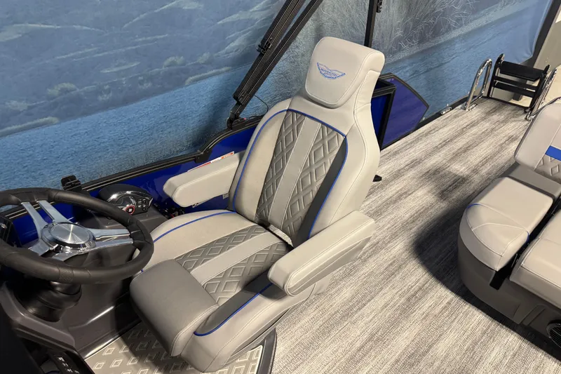 Slide: The Image of Captain's seat and steering wheel of 2026 Bennington 24 MSB boat, featuring elegant design and upholstery. - 9