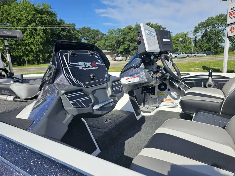 Slide: The Image of 2020 Skeeter FXR21 boat interior with modern dashboard and seating. - 14