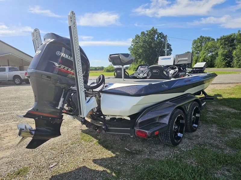 Slide: The Image of 2020 Skeeter FXR21 boat with Yamaha engine, parked outdoors on a sunny day. - 4