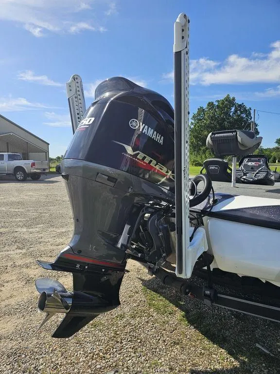 Slide: The Image of 2020 Skeeter FXR21 boat with Yamaha outboard motor in a sunny outdoor setting. - 6