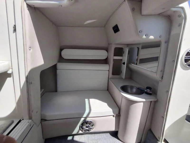 Slide: The Image of 1998 Envision 2900 Combo boat interior with seating and compact sink area. - 10