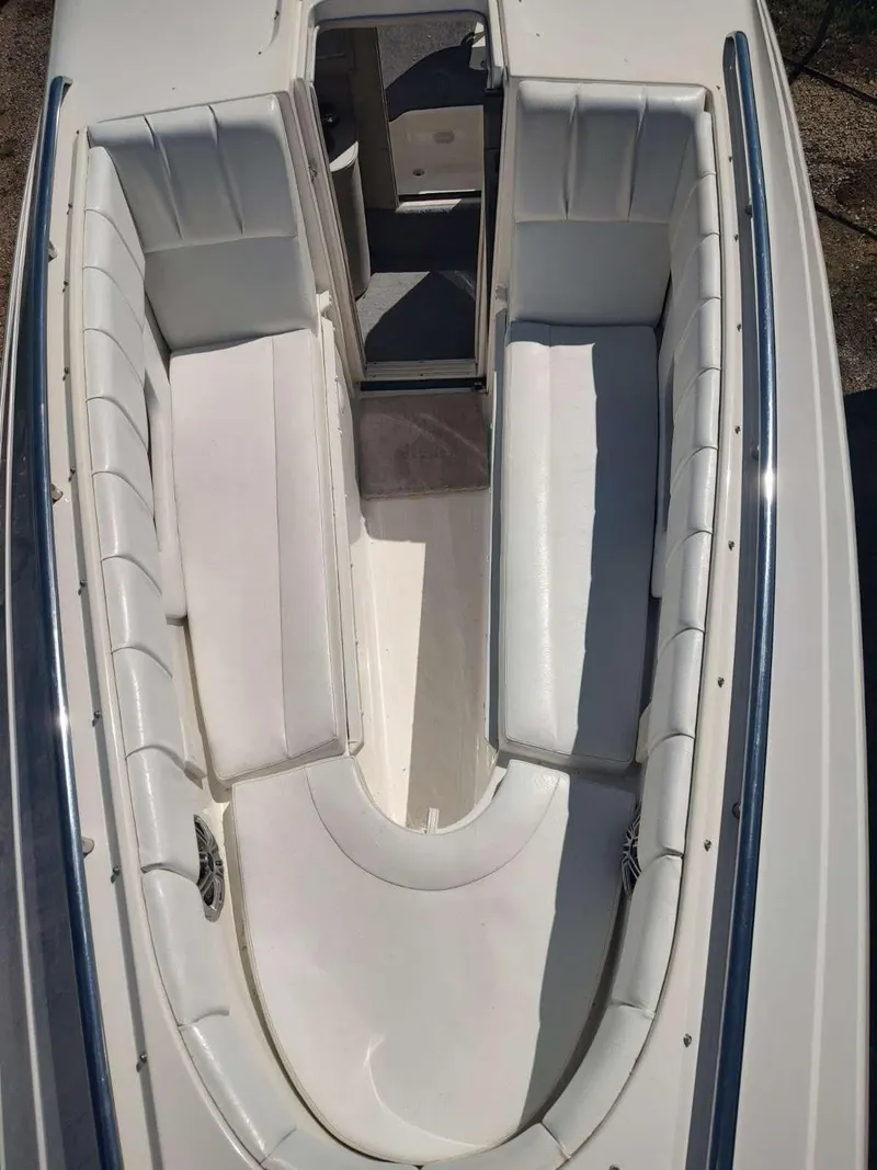 Slide: The Image of 1998 Envision 2900 Combo boat interior with white cushioned seating. - 17