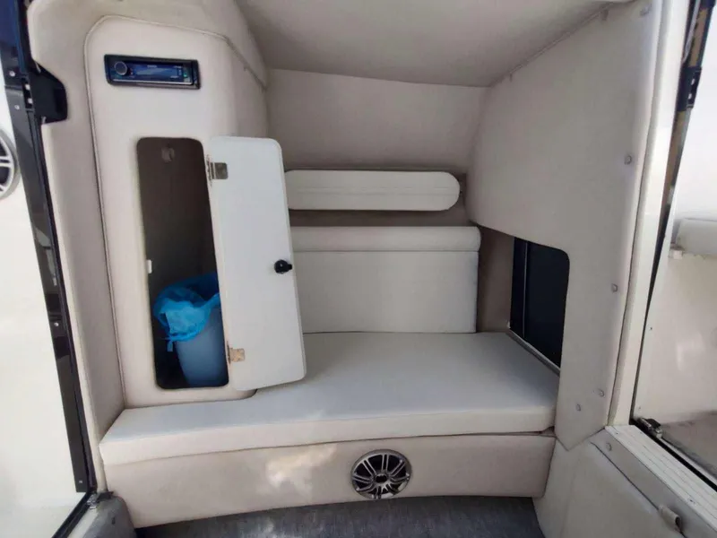 Slide: The Image of 1998 Envision 2900 Combo cabin interior with storage and seating area. - 22