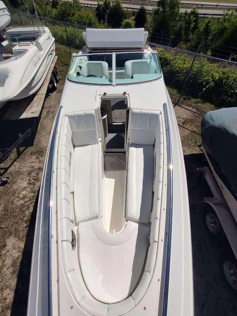 Slide: The Image of 1998 Envision 2900 Combo boat with spacious seating and sleek design. - 29