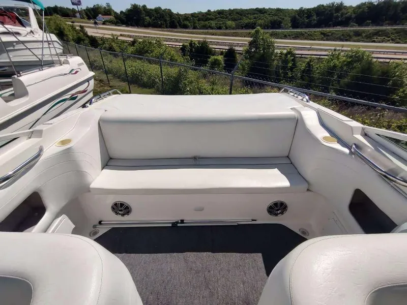Slide: The Image of 1998 Envision 2900 Combo boat interior with white seating and speakers. - 3