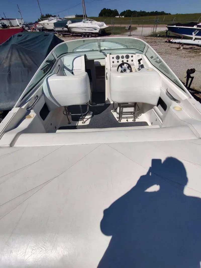 Slide: The Image of 1998 Envision 2900 Combo boat interior with dual seats and control panel. - 42