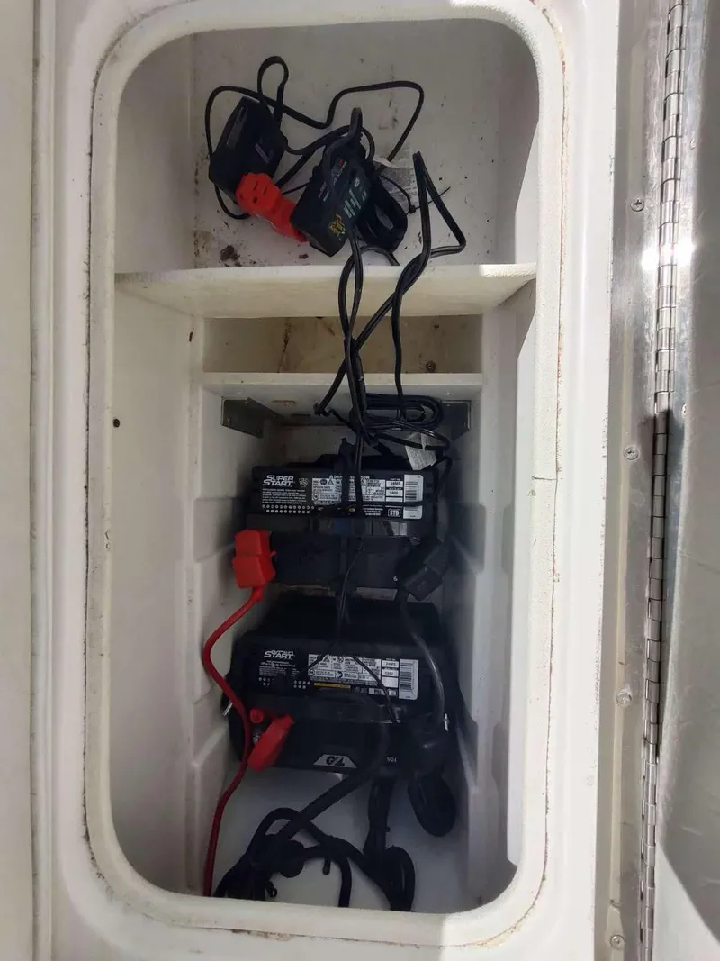Slide: The Image of Battery compartment of 1998 Envision 2900 Combo boat with wiring and chargers. - 9