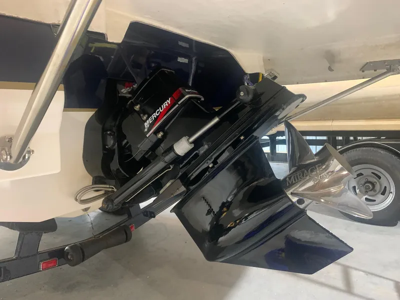 Slide: The Image of 2003 Bryant 232 RB boat with Mercury outboard motor and stainless steel propeller. - 12