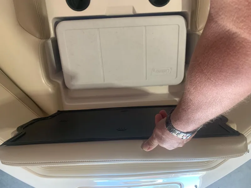 Slide: The Image of Man adjusting seat on 2003 Bryant 232 RB boat interior. - 17