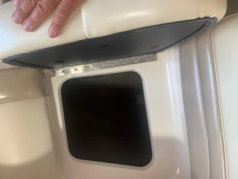 Slide: The Image of Open storage compartment in a 2003 Bryant 232 RB boat seat. - 18