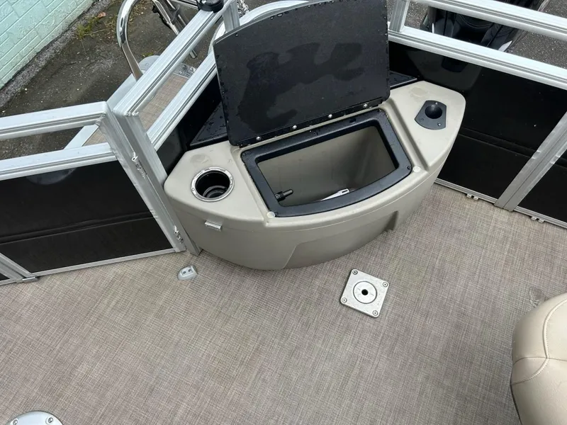 Slide: The Image of 2024 Sun Tracker Sport Fish 20 DLX boat interior with open storage compartment. - 10
