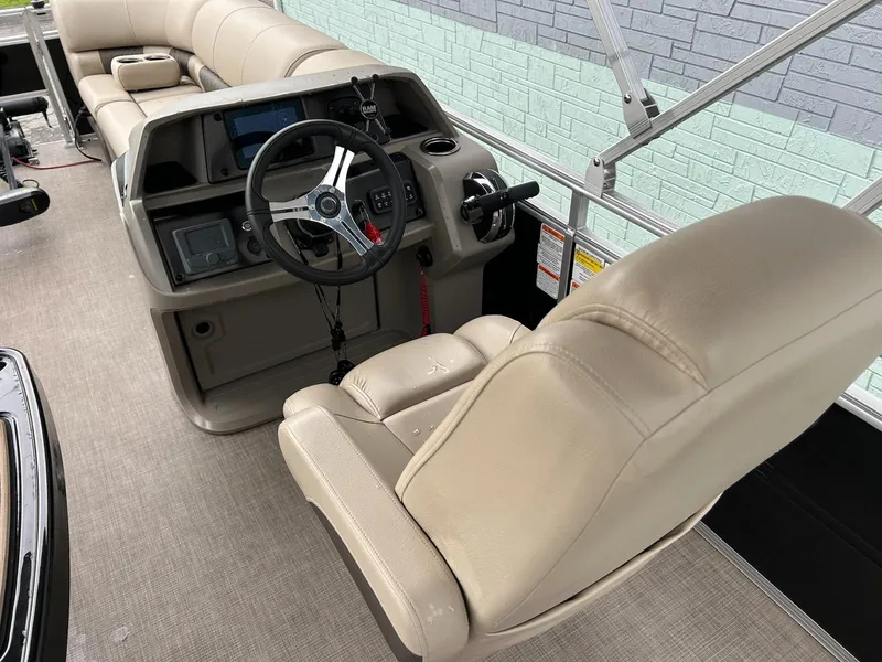 Slide: The Image of 2024 Sun Tracker Sport Fish 20 DLX boat interior with steering console and seating. - 8