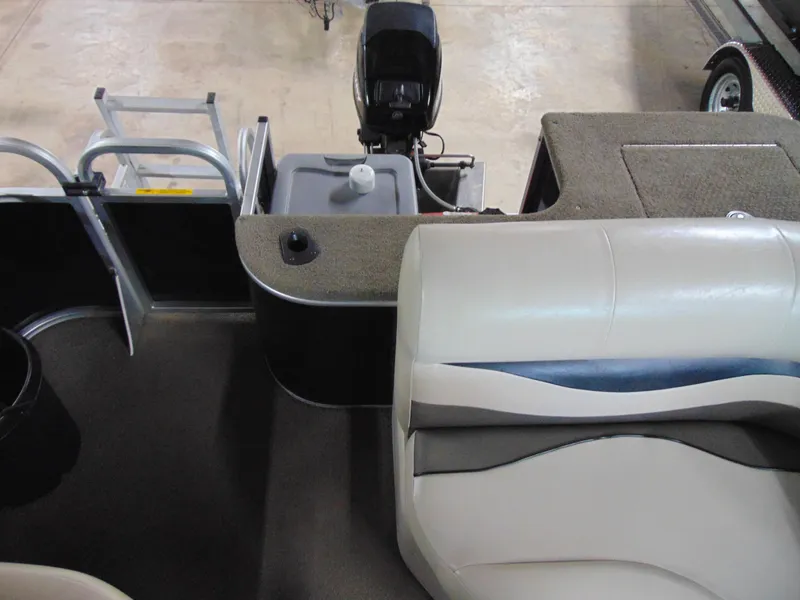 Slide: The Image of Interior view of a 2012 Apex Marine 1716 boat, featuring seating and motor. - 11