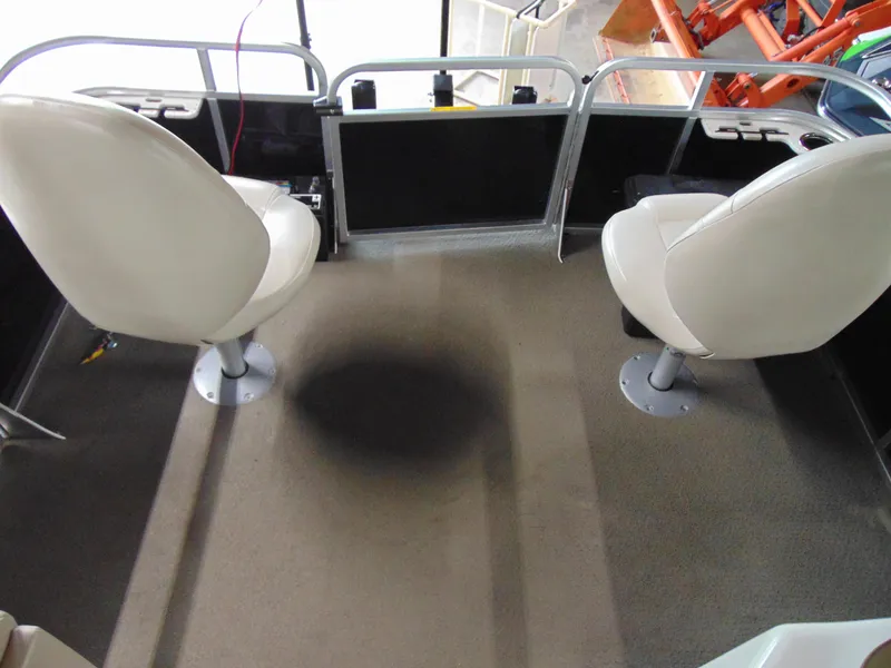 Slide: The Image of Interior of a 2012 Apex Marine 1716 boat with two swivel seats. - 15