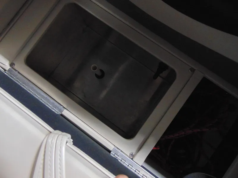 Slide: The Image of Storage compartment in a 2012 Apex Marine 1716 boat, featuring a rectangular design. - 17