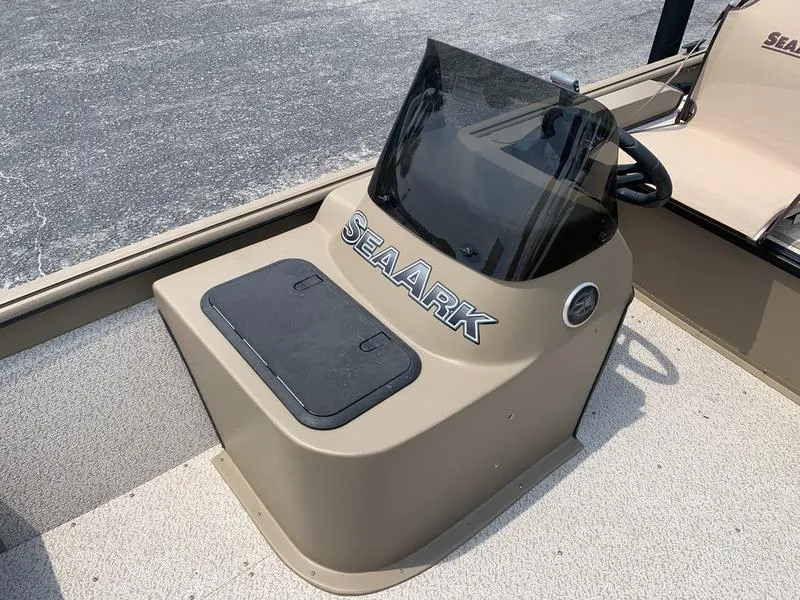 Slide: The Image of 2025 SeaArk Shadow 17 Side Console boat with windshield and storage compartment. - 15