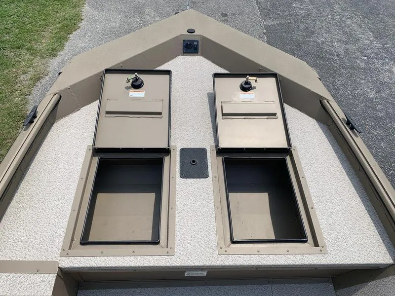 Slide: The Image of 2025 SeaArk Shadow 17 Side Console boat with open storage compartments. - 18