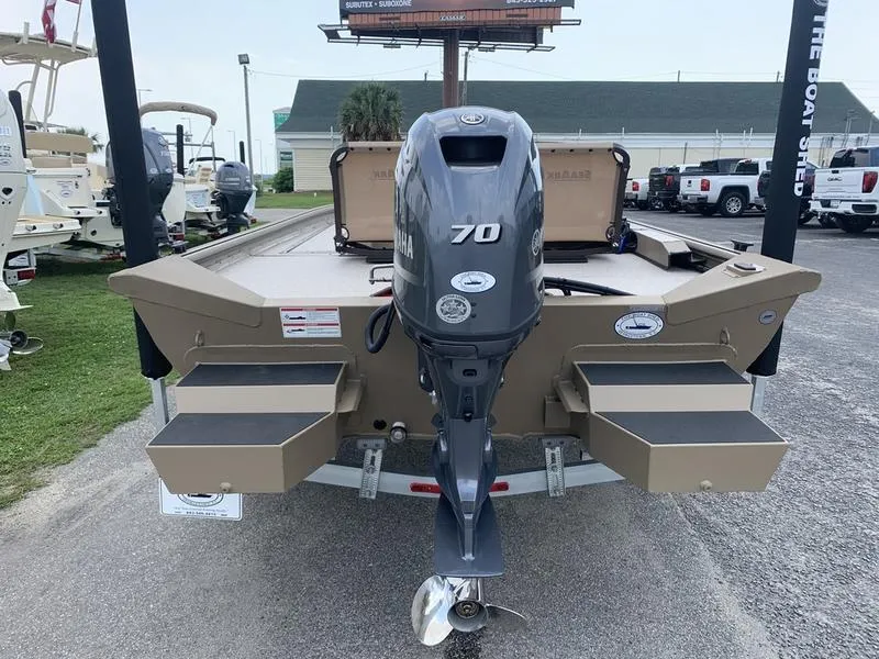 Slide: The Image of 2025 SeaArk Shadow 17 Side Console boat with Yamaha 70 engine, rear view. - 2