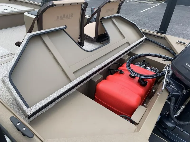 Slide: The Image of 2025 SeaArk Shadow 17 Side Console boat interior with red fuel tank and steering wheel. - 8