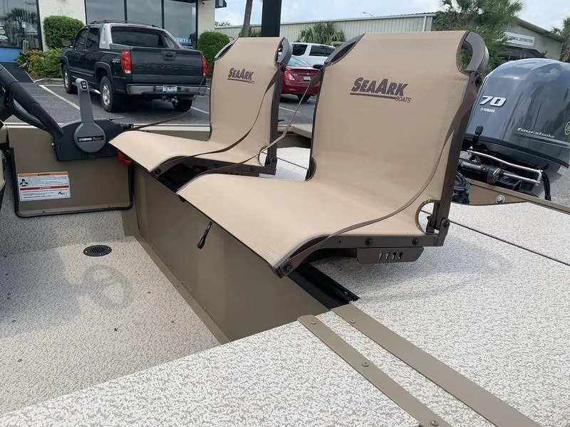 Slide: The Image of 2025 SeaArk Shadow 17 Side Console boat with dual beige seats and Yamaha outboard motor. - 9