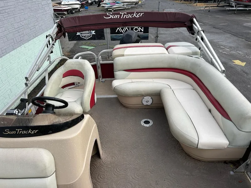 Slide: The Image of 2012 Sun Tracker Party Barge 22 DLX with spacious seating and maroon accents. - 5