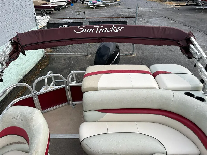 Slide: The Image of 2012 Sun Tracker Party Barge 22 DLX with cushioned seating and canopy. - 8