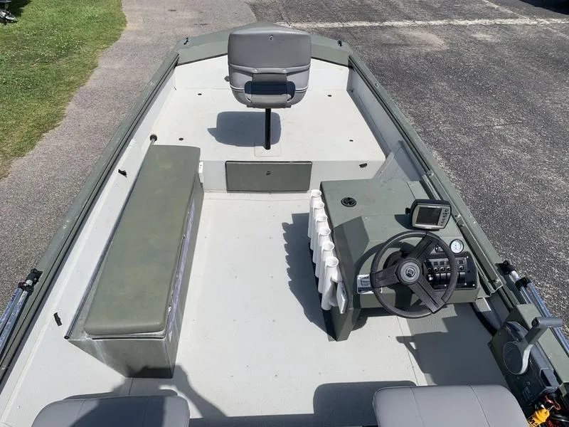 Slide: The Image of 2007 Triton 1756S boat interior with seating, steering console, and navigation equipment. - 10