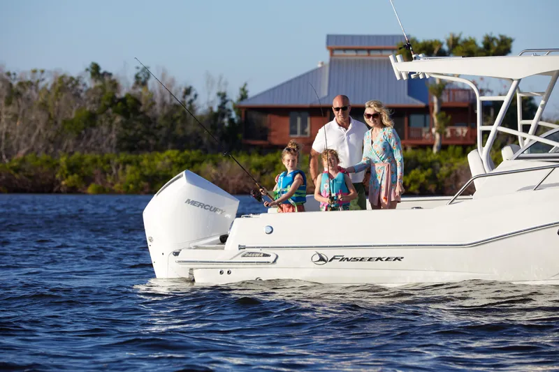 Slide: The Image of Family enjoying fishing on a 2024 Finseeker 240 WA boat in scenic waters. - 16