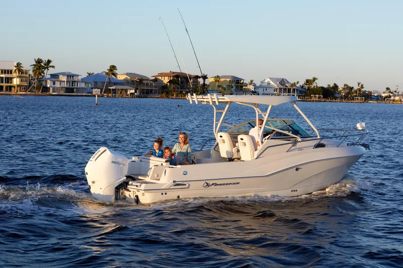 Slide: The Image of 2024 Finseeker 240 WA boat cruising on a sunny day with passengers onboard. - 3