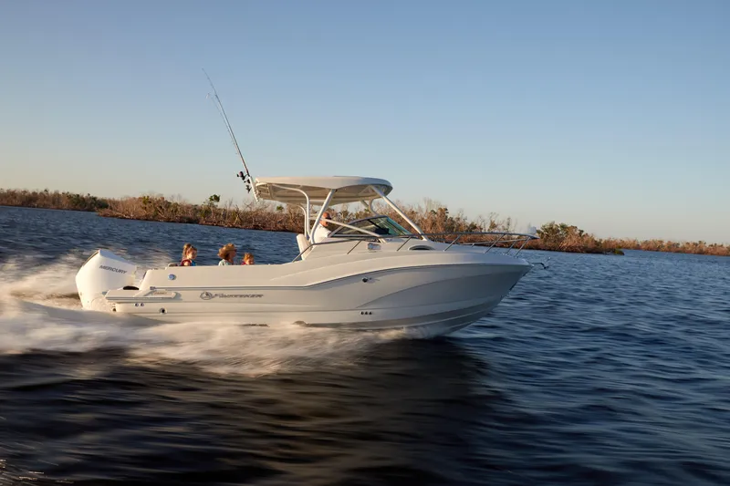 Slide: The Image of 2024 Finseeker 240 WA boat cruising on open water at sunset. - 8