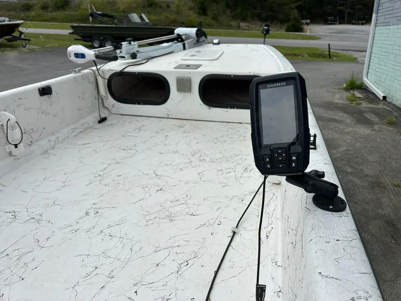 Slide: The Image of 2004 Carolina Skiff J1650 boat with Garmin fish finder on deck. - 8