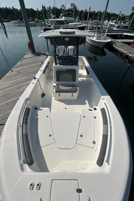 Slide: The Image of 2022 Sea Born LX26 Center Console boat docked at a marina. - 17