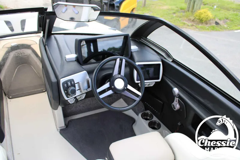 Slide: The Image of 2017 Malibu Wakesetter 20 VTX dashboard with steering wheel and control panels. - 11