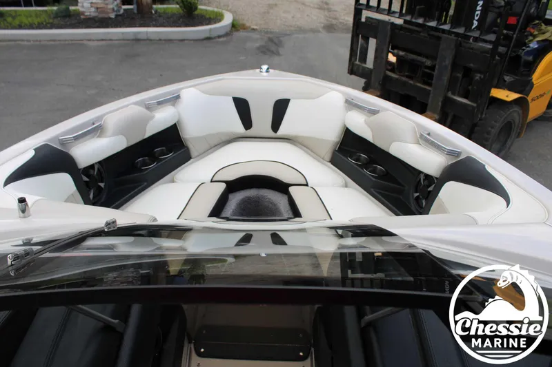 Slide: The Image of 2017 Malibu Wakesetter 20 VTX boat interior with white seating and cup holders. - 12