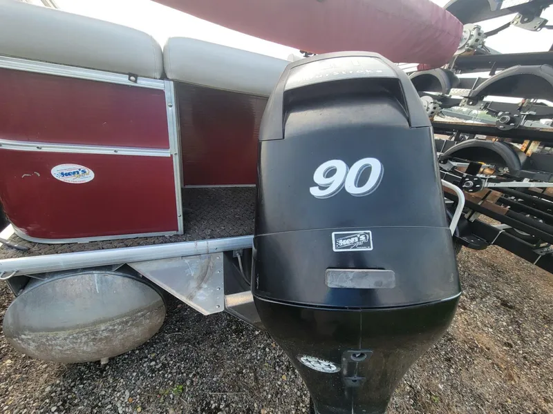 Slide: The Image of 2011 Misty Harbor 2285 DR pontoon boat with 90 HP outboard motor, red and silver design. - 4