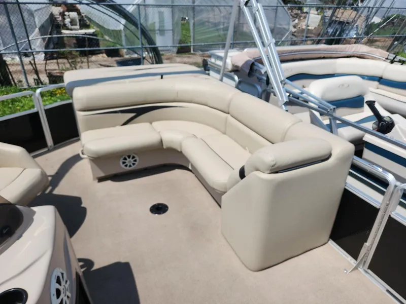 Slide: The Image of 2011 Harris FloteBote 200 Cruiser CX with beige seating and spacious deck layout. - 11