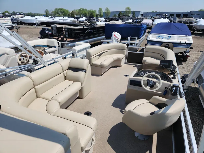 Slide: The Image of 2011 Harris FloteBote 200 Cruiser CX pontoon boat with beige seating and steering console. - 7
