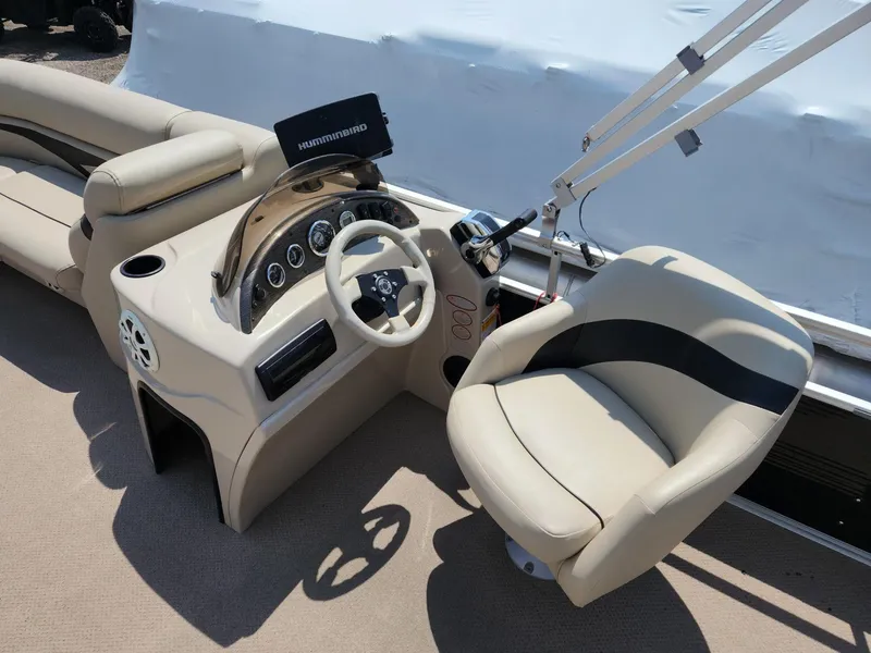 Slide: The Image of 2011 Harris FloteBote 200 Cruiser CX helm with steering wheel and comfortable seating. - 9