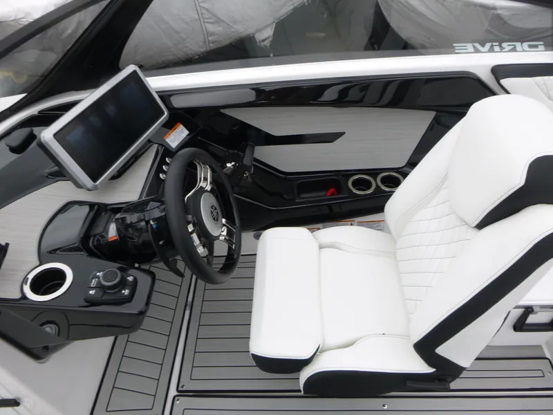 Slide: The Image of 2025 Yamaha Boats 222SD cockpit with modern steering, touchscreen, and white seating. - 5