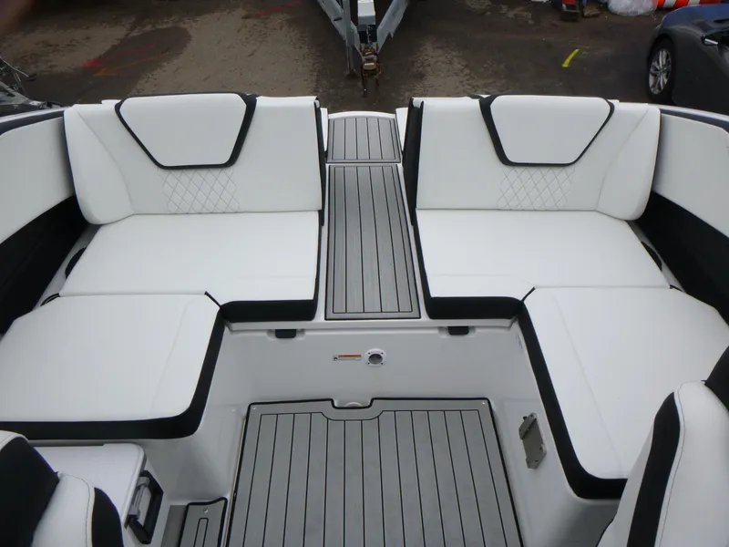 Slide: The Image of 2025 Yamaha Boats 222SD interior with white seating and sleek design. - 8