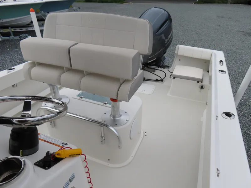 Slide: The Image of 2021 Parker 2300 Special Edition boat interior with seating and steering wheel. - 13