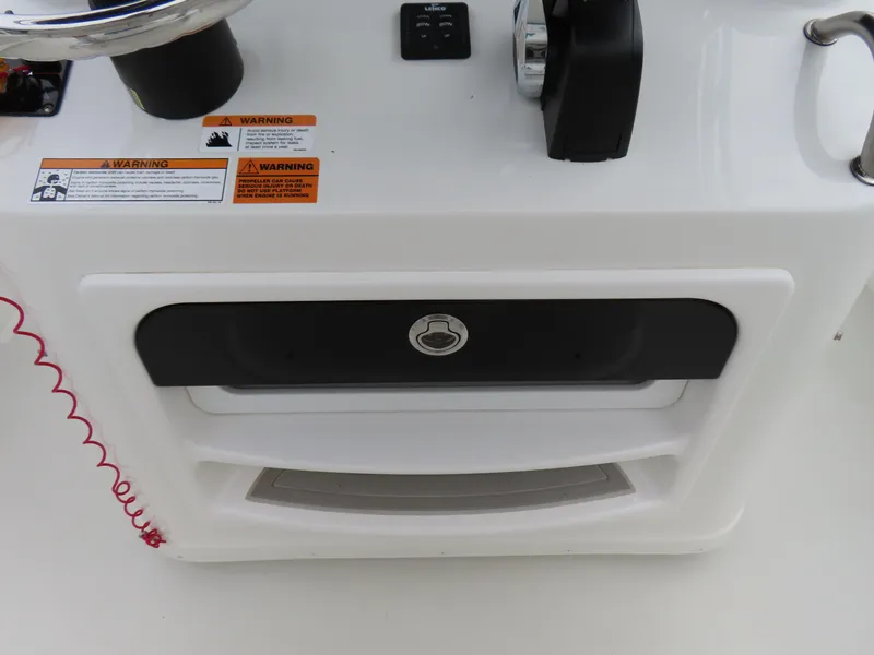 Slide: The Image of Control panel of a 2021 Parker 2300 Special Edition boat with warning labels. - 20