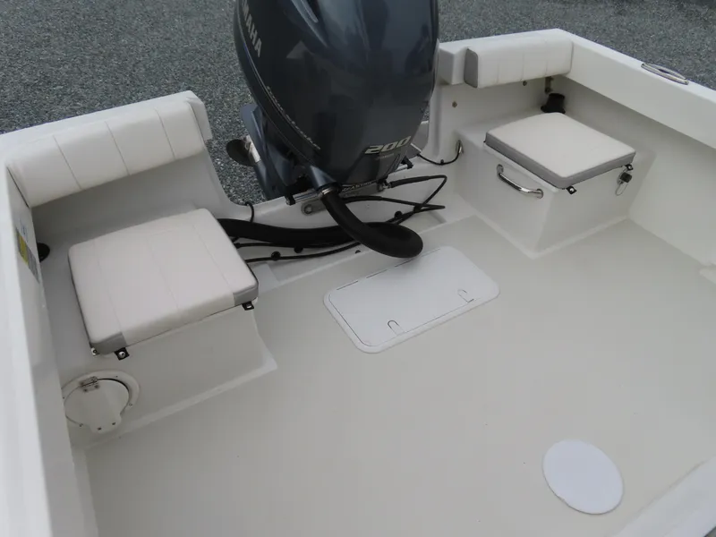 Slide: The Image of 2021 Parker 2300 Special Edition boat interior with Yamaha engine and cushioned seating. - 24
