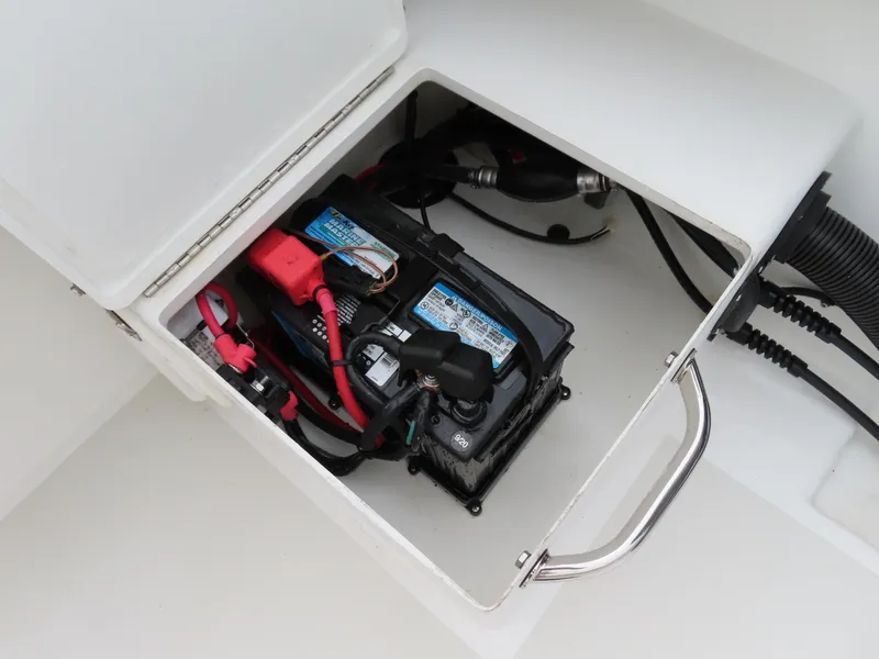 Slide: The Image of Battery compartment of 2021 Parker 2300 Special Edition boat, showing wiring and connections. - 27