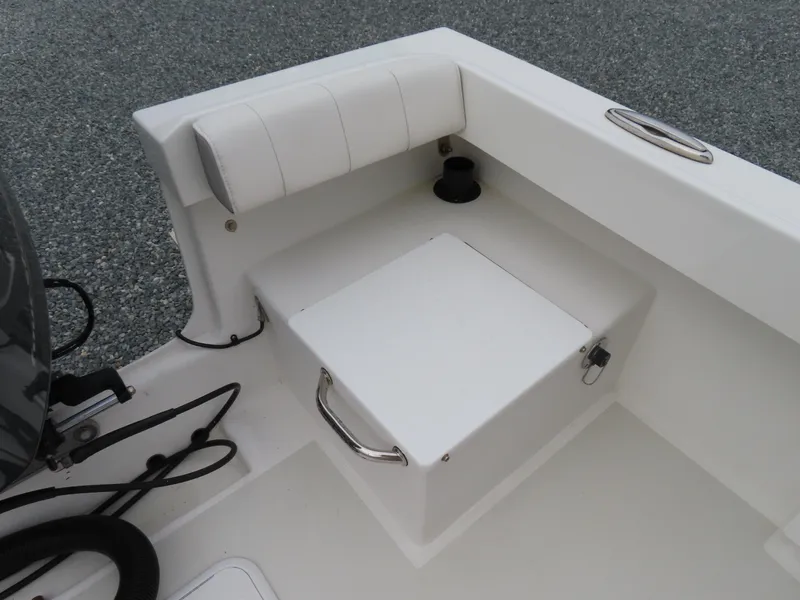 Slide: The Image of 2021 Parker 2300 Special Edition boat seating area with storage compartment. - 29