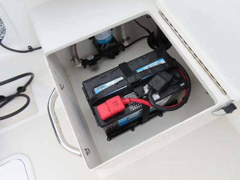 Slide: The Image of Battery compartment of 2021 Parker 2300 Special Edition boat, showing dual batteries and wiring. - 30