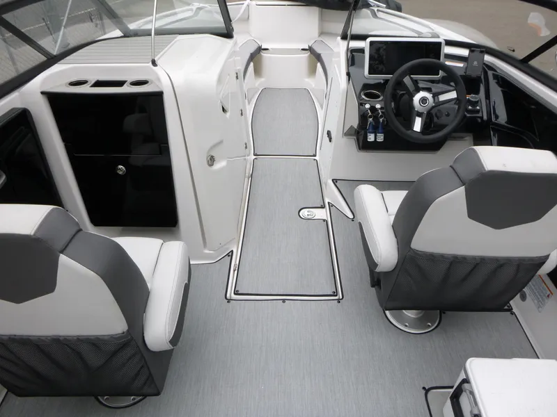 Slide: The Image of 2025 Yamaha Boats AR250 interior with modern helm, seating, and sleek design. - 2