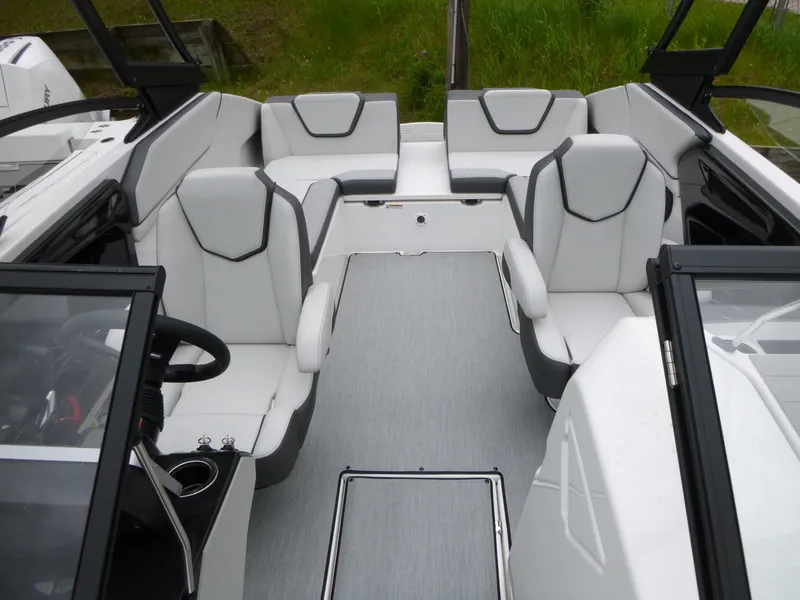 Slide: The Image of 2025 Yamaha Boats AR250 interior with sleek white seating and modern design. - 3